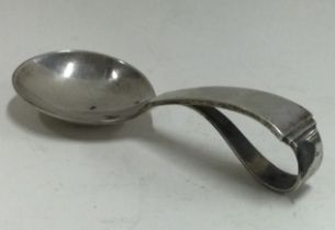 GEORG JENSEN: A silver caddy spoon of typical design bearing import marks.