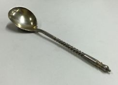 A Russian silver and Niello spoon engraved with a castle.