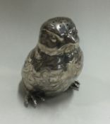 A silver pepper in the form of a bird bearing import marks.