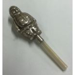 A silver rattle in the form of a person with MOP handle.