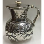 A good 19th Century American silver chased mug with hinged lid bearing import marks.