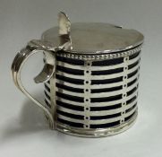 An 18th Century George III pierced silver mounted glass mustard pot.