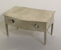 A novelty silver hinged box in the form of a table.