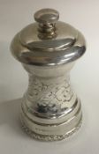 A heavy chased silver pepper grinder. Birmingham.