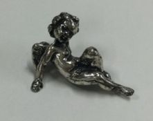 A miniature silver cherub.