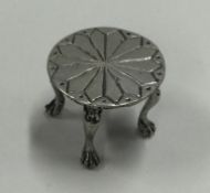 A miniature silver table.