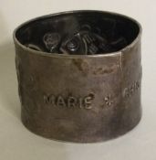 A large Continental silver napkin ring decorated with fish.