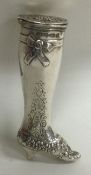 An unusual silver hinged top pill box in the form of a leg with engraved decoration.