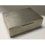 ASPREY & CO: A heavy silver cigar box with engine turned decoration.