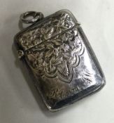 A small rectangular hinged silver vesta case.