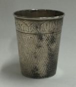 An American silver spirit tot in the form of a thimble inscribed with 'Just a Thimbleful'.