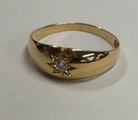 A good diamond single stone gypsy set ring in 18 carat gold mount.