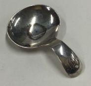 A Georgian style silver caddy spoon. London 1969.
