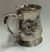 An 18th Century Georgian silver chased mug. Marked to base.