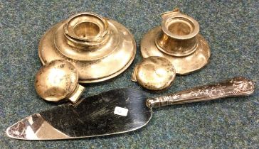 A small silver cake slice, inkwells etc.