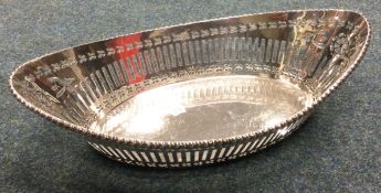 A heavy Edwardian silver boat shaped dish with pierced decoration.