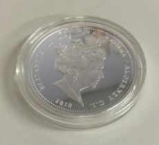A heavy silver £5 coin. Approx. 33 grams. Est. £20