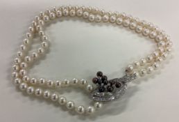 A good double row pearl necklace set with diamond