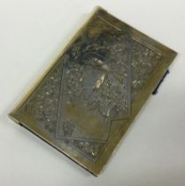 A good Victorian aesthetic movement silver card case engraved with birds.