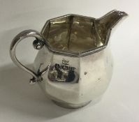 A heavy Georgian style silver cream jug. Birmingha