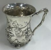 A good silver chased mug with vine decoration. London 1872.