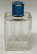 A silver and blue enamelled glass scent bottle.