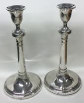 A large pair of Georgian silver crested candlesticks. London 1773.