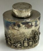 A heavy silver tea caddy with figural decoration.
