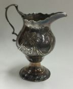 An early 18th Century silver jug. London 1777.