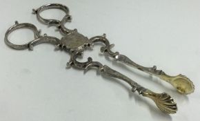 A pair of 18th Century silver sugar nips.