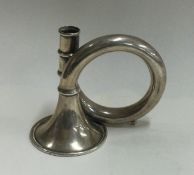 CHESTER: A miniature silver trumpet. 1929.