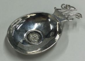 A heavy Modernistic silver caddy spoon with 1937 Coronation coin to centre.