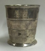 A heavy Victorian silver fluted beaker. London 1857.