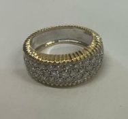 A good 18 carat gold diamond cluster ring with textured decoration.