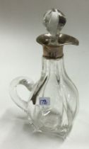 A silver mounted glass whisky decanter. Birmingham 1907.