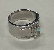 A large emerald cut diamond single stone ring in 1