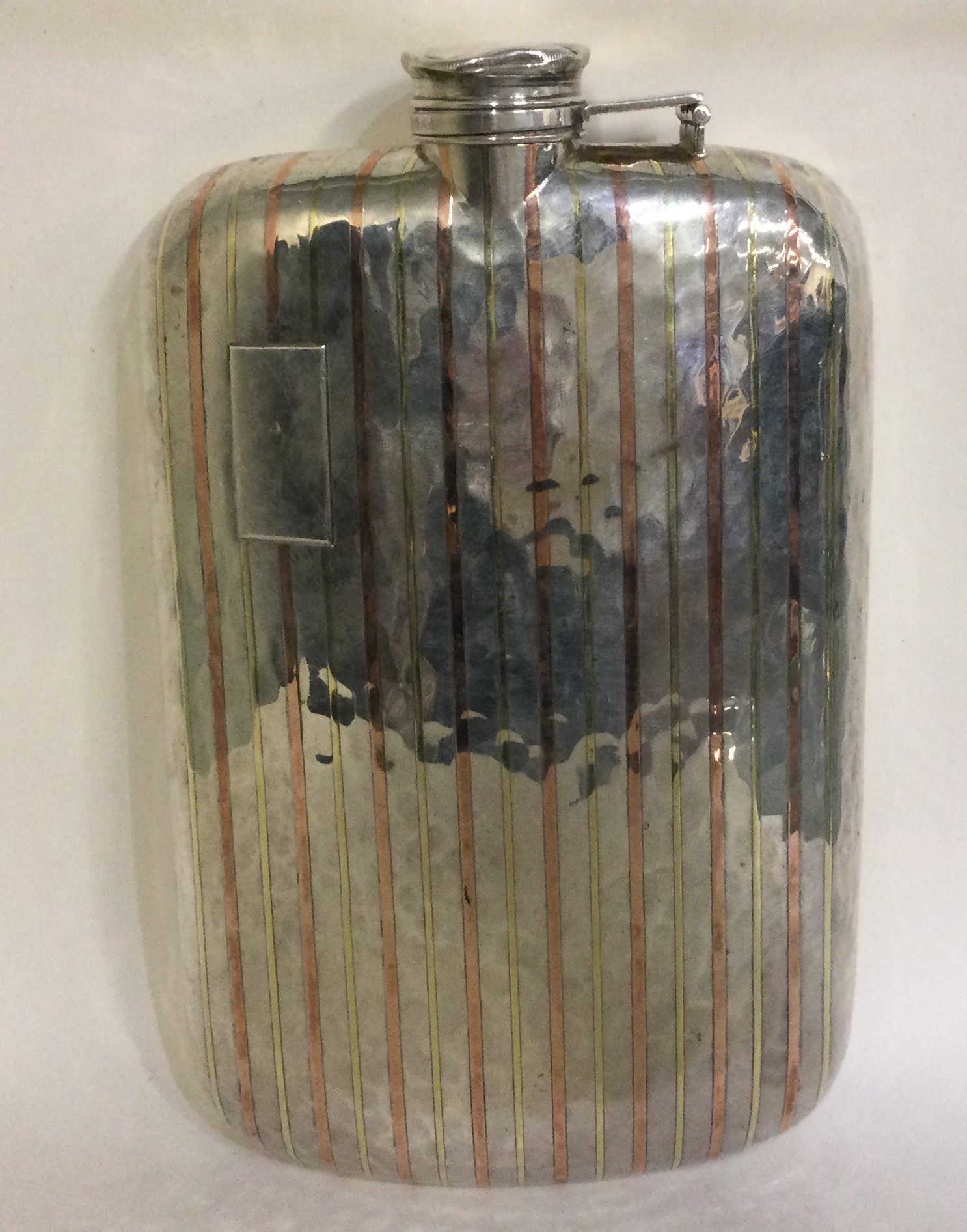 A large American silver and gold inlaid flask.