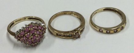 A group of three 9 carat gem set rings.