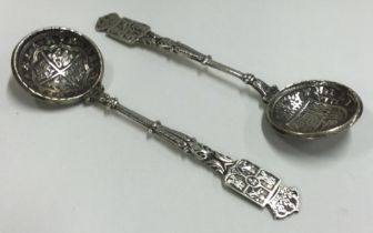 A pair of early Antique Spanish silver spoons set with coins.