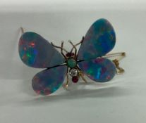 A large opal butterfly brooch with outstretched wi