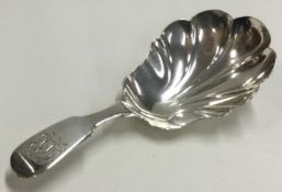 EXETER: A William IV silver caddy spoon with fluted bowl.