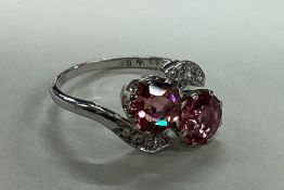 A unusual tourmaline and diamond crossover ring in