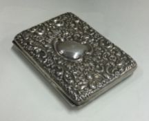 CHESTER: A chased silver card case. 1906.