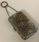 A Continental silver and enamelled purse with suspension chain.
