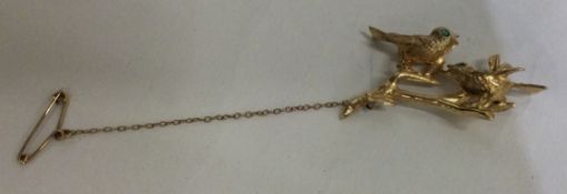 An unusual 9 carat diamond love birds brooch.