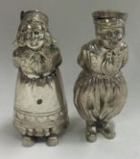 A fine pair of 19th Century Dutch silver figural pepperettes.