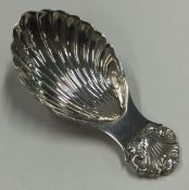 A George III silver caddy spoon with bright cut decoration.