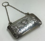 A silver purse embossed with cherubs. Birmingham 1901.