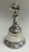 A Victorian silver figural table bell. London 1881.