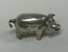 A silver cast figure of a pig. London 1994.